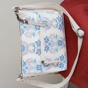 Floral Leather Crossbody by The Sak  Like new  All charms /logo fob Clean lining